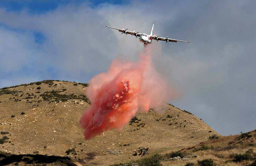 Coulson's C-130Q/H drops a load of retardant in California while on summer contract to the USFS. Skip Robinson Photo