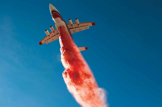 The Conair RJ85 drops a load of retardant during U.S. Interagency Air Tanker Board grid tests at Fox Field in California. Conair achieved a flow rate in excess of 12,000 litres per second on the external RJ85 tank. Jeff Bough/Conair Photo