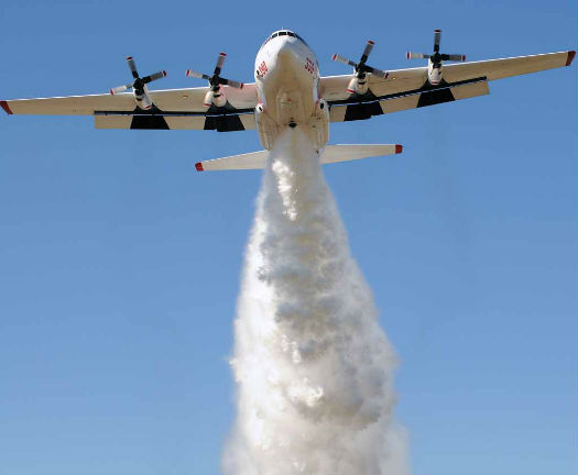Coulson's C-130Q/H demonstrates a water drop to Australian fire agency officials at Avalon, but it drops retardant on actual missions. Coulson Aviation/Victoria State Photo