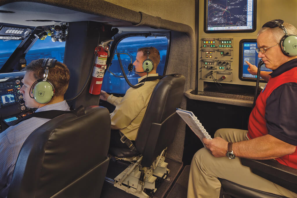 Students practice with instruction inside a FlightSafety flight simulator, as well as classroom and engine repair and maintenance. FlightSafety Photo