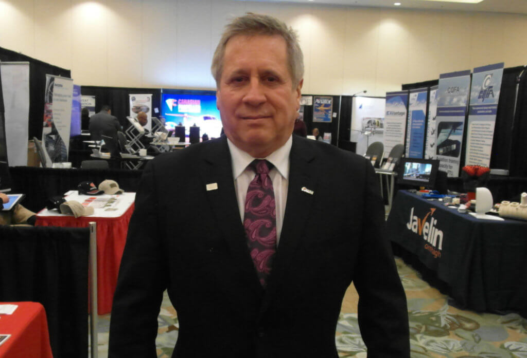 Air Transport Association of Canada president John McKenna walks the tradeshow floor at the organization’s annual conference in Vancouver, B.C. This year, 52 companies exhibited products and services geared toward the air transport industry. Lisa Gordon Photo