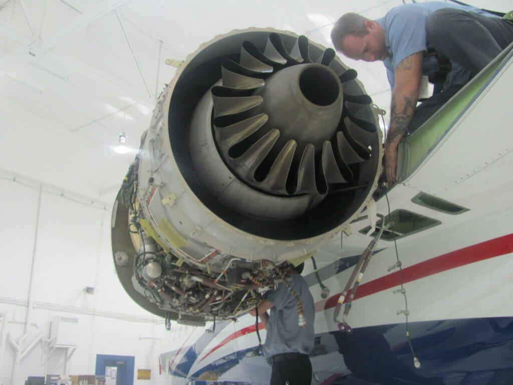 Man working on aircraft engine