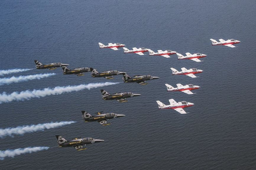 Here, the Breitling Jet Team flies with the Canadian Forces Snowbirds in Toronto.