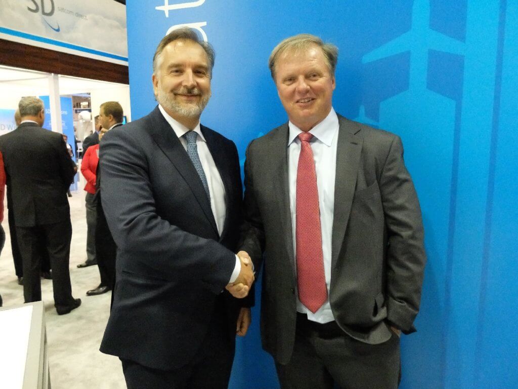 Jim Jensen, founder and CEO of Satcom Direct, right, shakes hands with Mark van Berkel, president and CEO of TrueNorth Avionics, at NBAA 2016. During the show, it was announced that Ottawa-based TrueNorth would be acquired by Satcom Direct. Lisa Gordon Photo