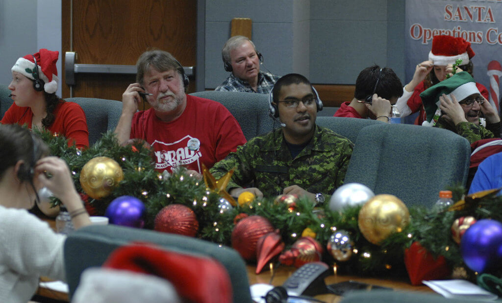 Some volunteers dress in military uniforms. Others could pass for the jolly elf himself. NORAD Photo