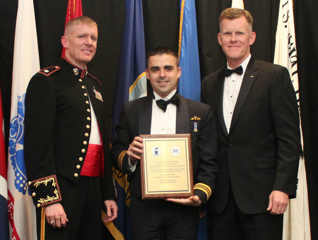 The RCAF's Maj Max Renaud (centre) displays the Outstanding Student Award for academic and flying achievements that he has just received from U.S. Navy Captain (ret'd) Stephen Schmeiser (right), vice-president of the Association of Naval Aviation; and U.S. Marine Corps LCol Timothy A. Davis, commanding officer of the U.S. Naval Test Pilot School. Col Tom Dunne Photo