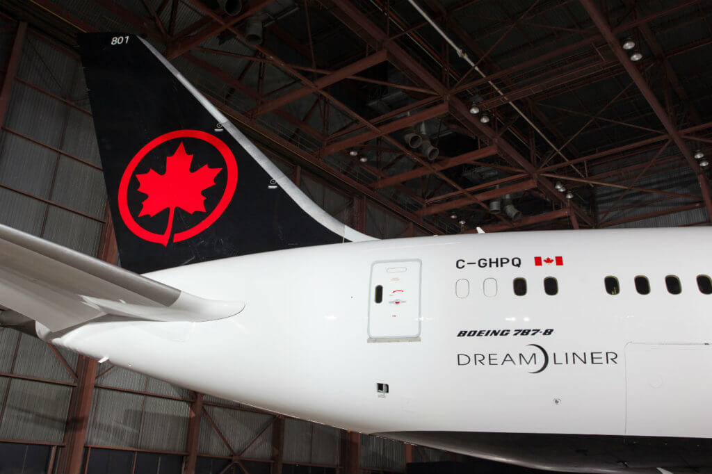 Photo captures the tail of the Air Canada Dreamliner, with new livery.
