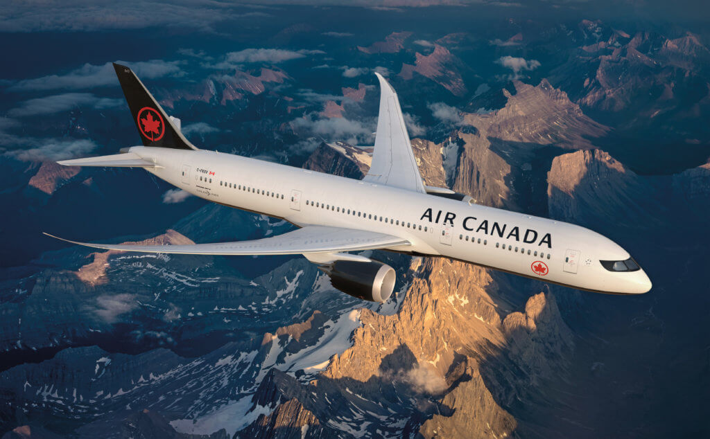 Air Canada airliner in flight, with new livery