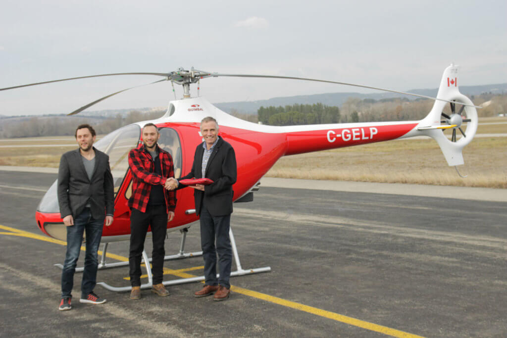 Mischa and Sancho Gelb, owners of British Columbia-based BC Helicopters, stand with Bruno Guimbal, president and CEO of Hélicoptères Guimbal.