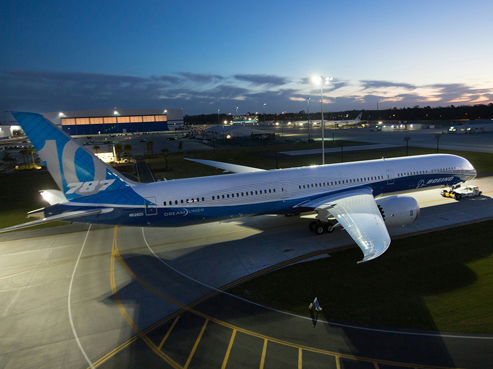 Boeing 787-10 Dreamliner rests on the ground.
