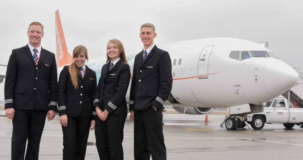 From left to right are newly-minted Sunwing First Officers Cameron Fuchs, Chelsea Anne Edwards, Siobhan O'Hanlon and Spencer Leckie on the ramp at the Regional of Waterloo International Airport. Mike Reyno Photo