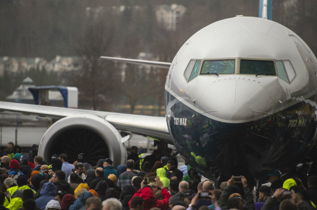 Nose of the Boeing 737 MAX 9 faces the camera, with crowd gathered around.