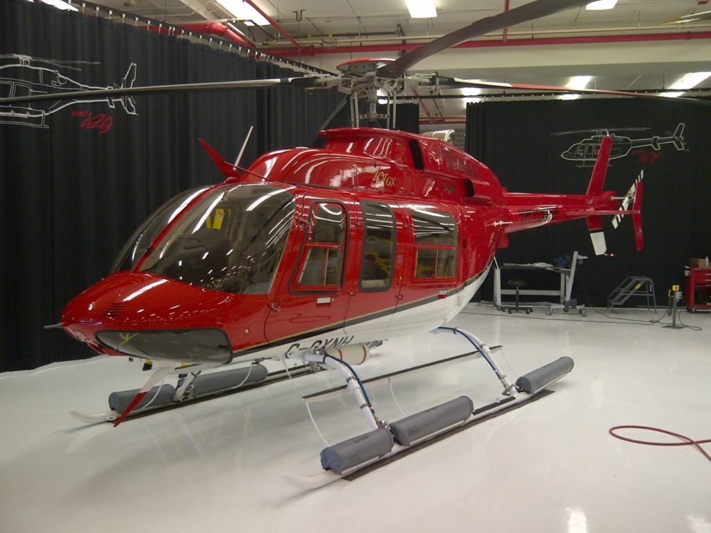 Bell 407GXP helicopter resting inside building