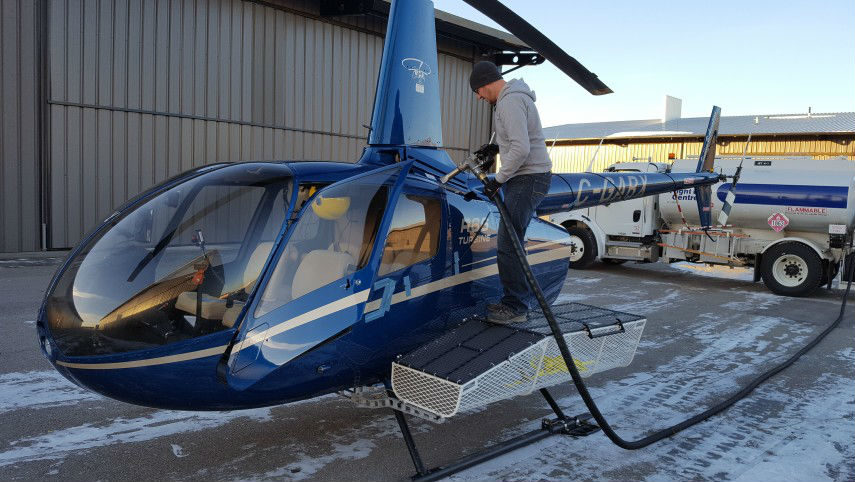 Man working on R66 helicopter