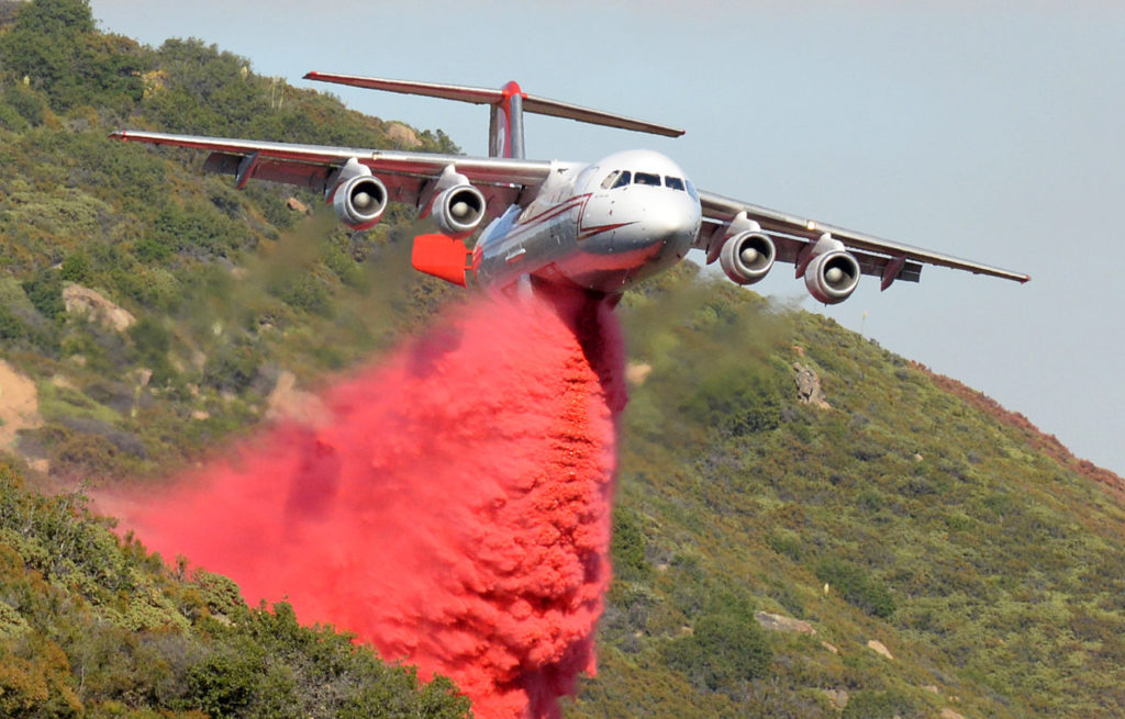 A British Aerospace BAe-146 belonging to Neptune Aviation makes a phoschek drop Saturday June 18, 2016 on the Sherpa Fire in Santa Barbara County. 