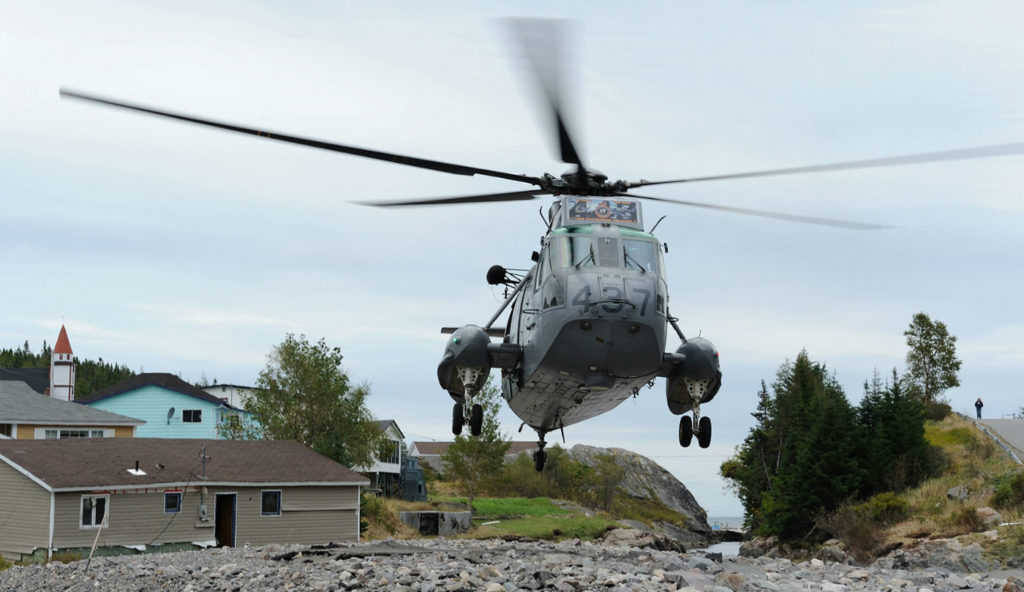 A CH-124 Sea King from 423 Maritime Helicopter Squadron, Shearwater, N.S., takes off from a river bed in the small community of Trouty, N.L. The squadron was supporting relief efforts in the province following Hurricane Igor in September 2010. MCpl Angela Abbey Photo