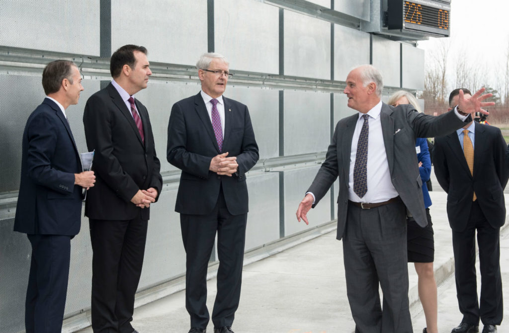 Marc Garneau joins PortsToronto CEO Geoffrey Wilson and Gene Cabral, executive vice-president of Billy Bishop Toronto City Airport on a tour of the new ground run-up enclosure.