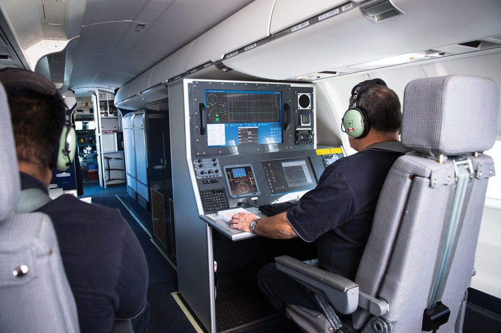 Technical flight inspectors operate the onboard flight calibration instruments, while additional inspectors work on the ground to adjust the nav aids if issues are discovered. Nav Canada Photo