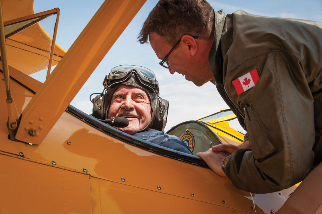 Harry Hannah of Oakville, Ont., chats with pilot Todd Lemieux after a flight in a Boeing Stearman dedicated in his name. Scottish-born Hannah, 94, was a Spitfire pilot with 602 Squadron, training on the Stearman in America in 1941. Peter Handley Photo