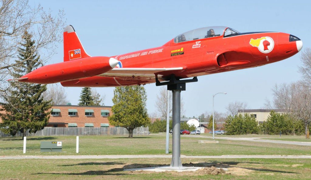 One of five Canadair CT-133 Silver Star jet fighter trainers used by the Red Knight team sits on its pedestal adjacent to the Royal Canadian Air Force Academy, Building S-137, at 16 Wing Borden, Ont. Sgt Kev Parle/RCAF Photo