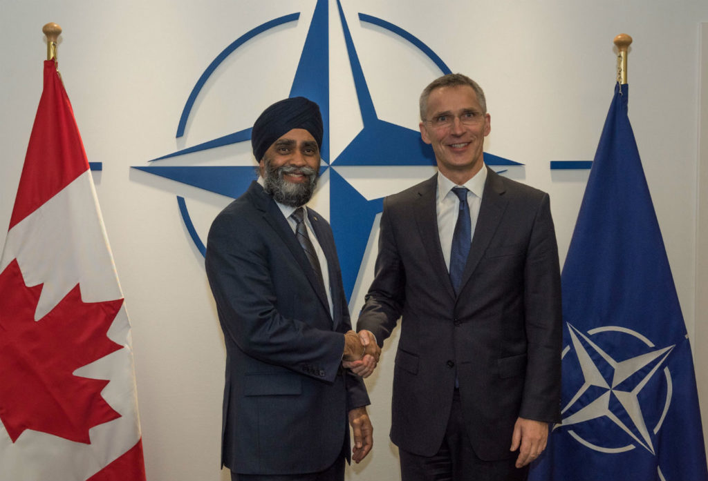 Defence Minister Harjit Sajjan said 88 fighters are required to fully meet NORAD and NATO obligations simultaneously, not just risk-manage them, as the RCAF has had to do for a number of years. Here, Sajjan, left, meets with NATO Secretary General Jens Stoltenberg at NATO headquarters in Brussels, Belgium, on Feb. 16, 2017. DND Photo