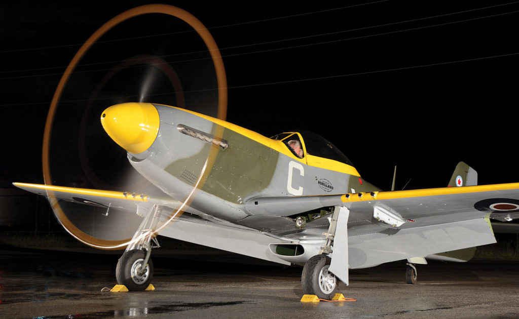 Mike Potter throttles up the Rolls-Royce Merlin of his North American P-51D Mustang for a night photography shoot. The Mustang is painted in 442 Squadron RCAF markings and is dedicated to Larry and Rocky Robillard, two Ottawa brothers who flew with 442 Squadron during the Second World War. Photos by Peter Handley 