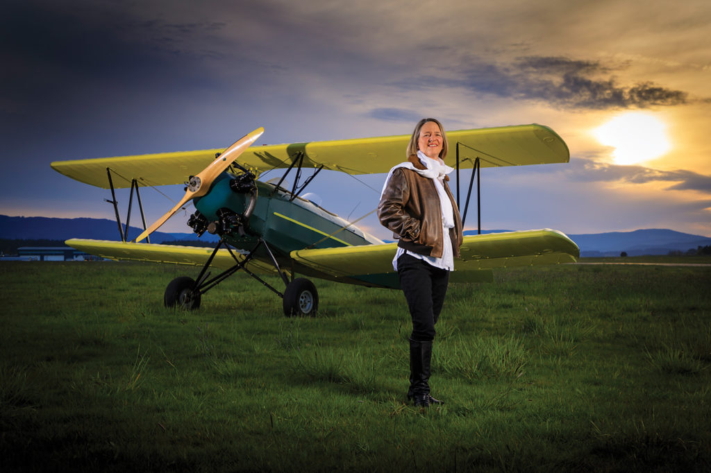 A captain with Air Canada, Suzanne Pettigrew started out at Quebec's CQFA aviation college in 1983. Here, she poses with a Fleet biplane at Victoria International Airport. Heath Moffatt Photo
