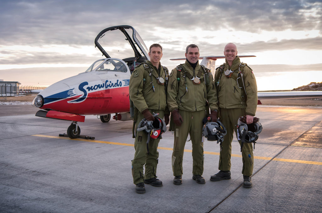 An early start to a January day in Moose Jaw as (L-R) Capt Philippe Roy, Maj Patrick Gobeil and Capt Brent Handy prepare to fly a morning practice with the team. Mike Luedey Photo