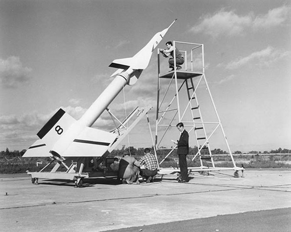 Avro technicians prepare an Avro Arrow test model attached to a Nike booster rocket to fire out over Lake Ontario at Point Petre in the 1950s.