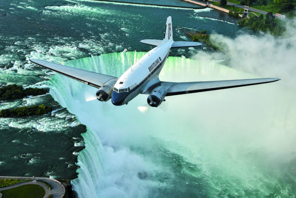 DC-3 flies over waterfall