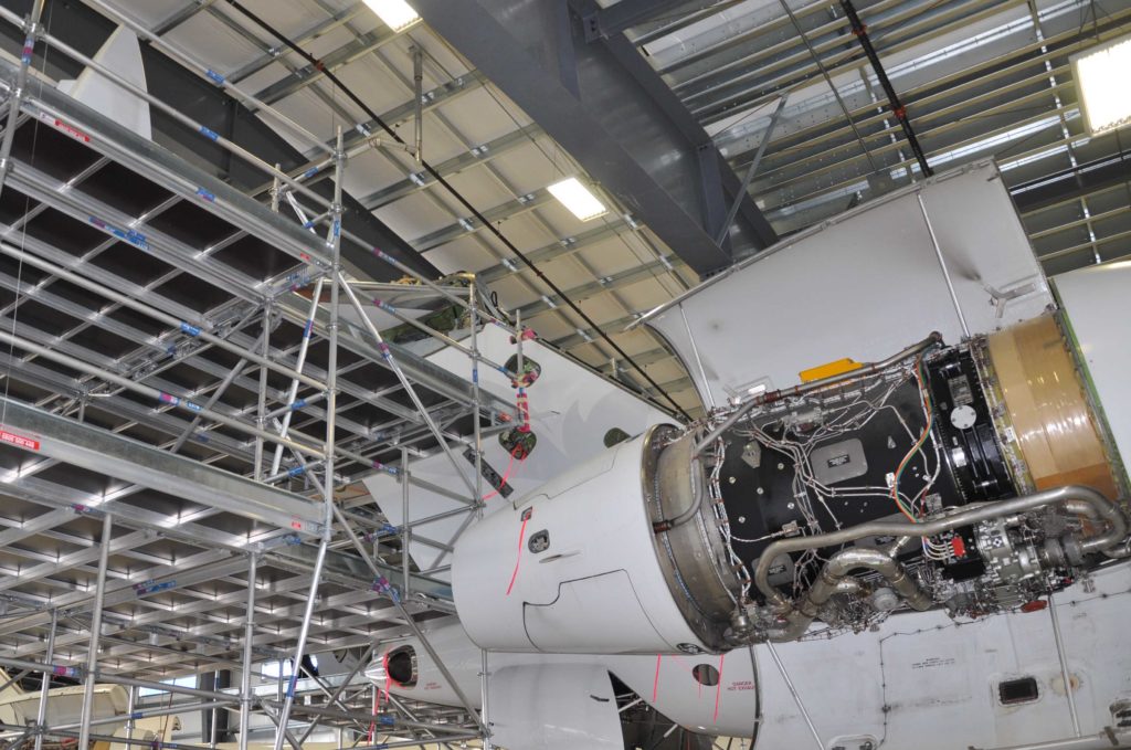 Aircraft engine exposed in hanger