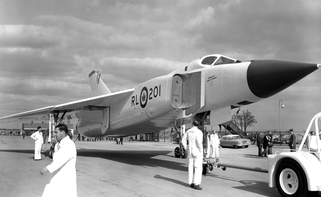 Front right view of an Avro Arrow sitting on the tarmac of de Havilland's hangar in Dowsview (Toronto), Ont., in 1957