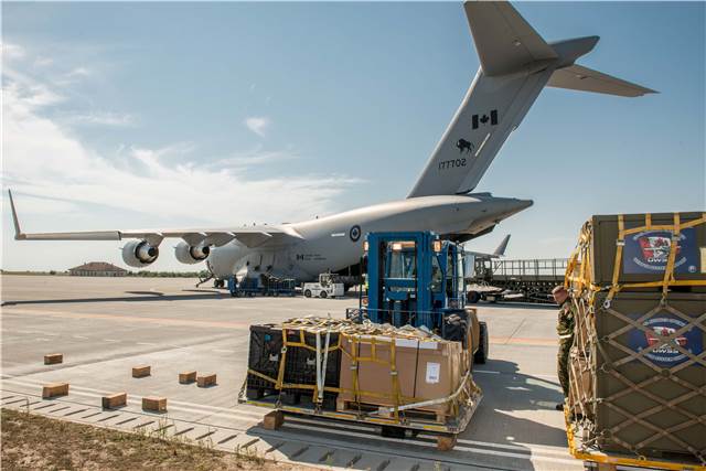Cargo gets unloaded from the CC-177 Globmaster III aircraft on the tarmac at Mihail Kogalniceanu Air Base, Constanta, Romania, on Sept. 6, 2017, during Operation Reassurance in support of NATO enhanced Air Policing. Sgt Daren Kraus Photo 