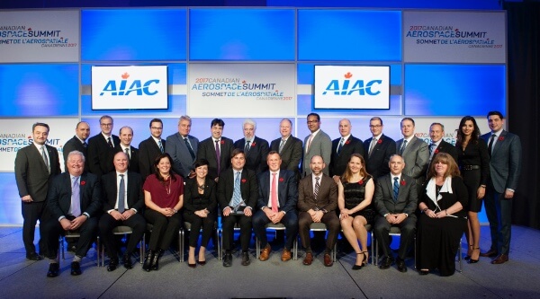 Jim Quick (seated, far left) with the 2017 James C. Floyd Award winners, including Benoit Beaudoin (seated, centre left) and John Saabas, president of Pratt & Whitney Canada (seated, centre right). AIAC Photo