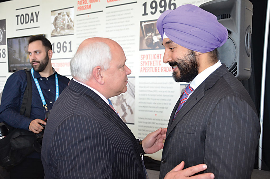 Lockheed Martin Canada's Charles Bouchard, left, with Navdeep Bains, minister of Innovation, Science and Economic Development. 