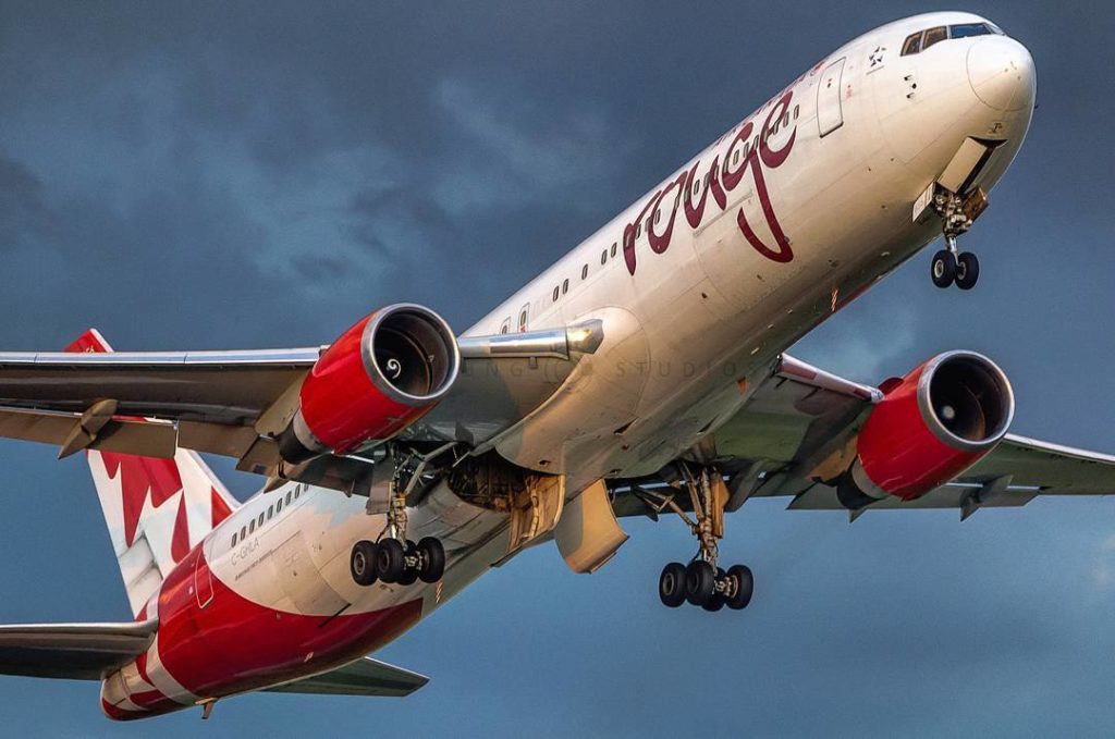 Ground view of an Air Canada Rouge Boeing 767 with eye-catching livery at Toronto Pearson International Airport. Photo submitted by John Chung (Instagram user @jcjchung) using #skiesmag