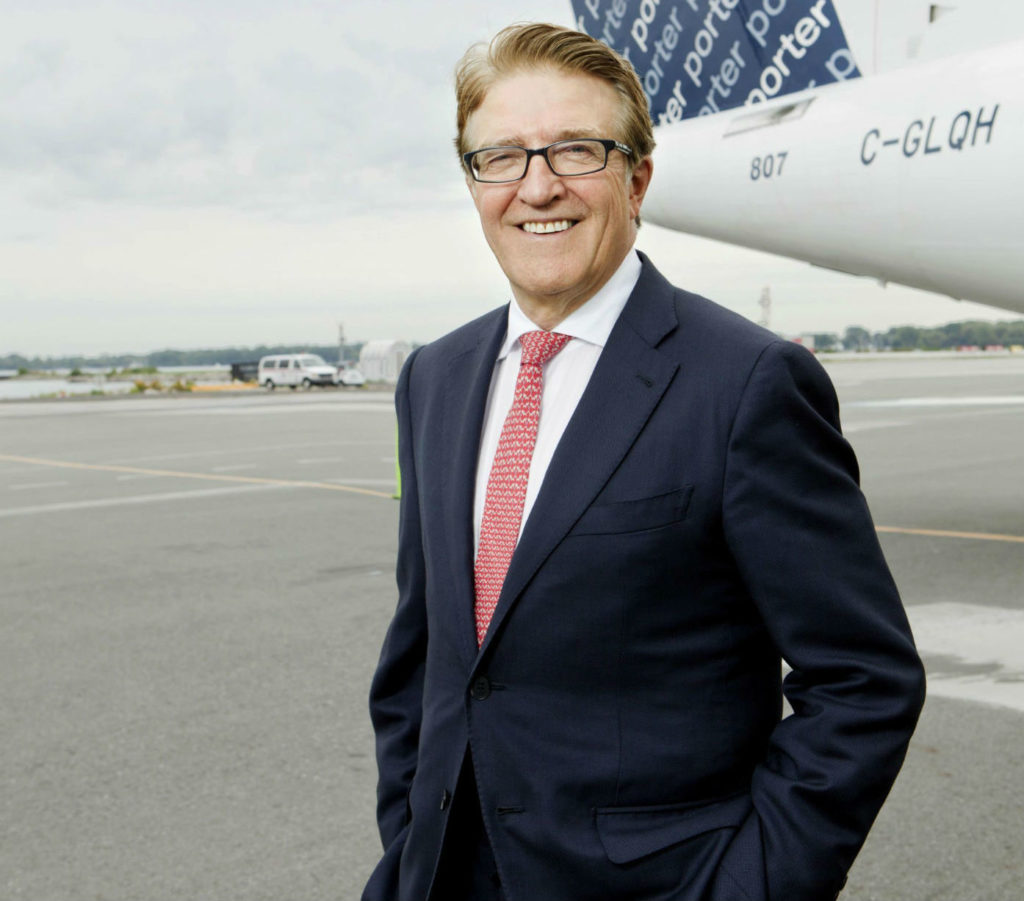 Porter Airlines president and CEO Robert Deluce stands with a Porter aircraft. 
