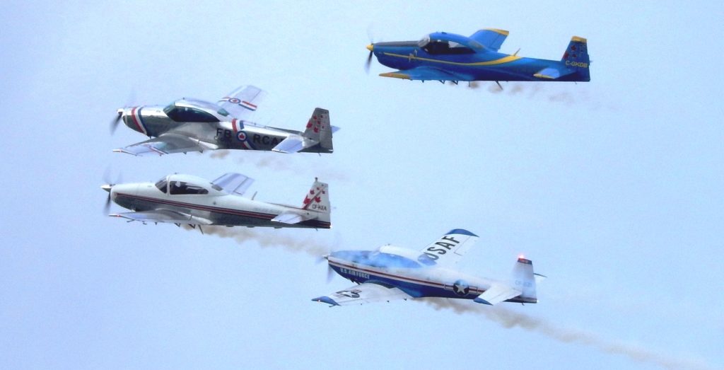 The Fraser Blues Navions in formation flight. George Miller leads with his son, Guy, on his right; Clive Barratt on his left; and Ray Roussy, outer left.