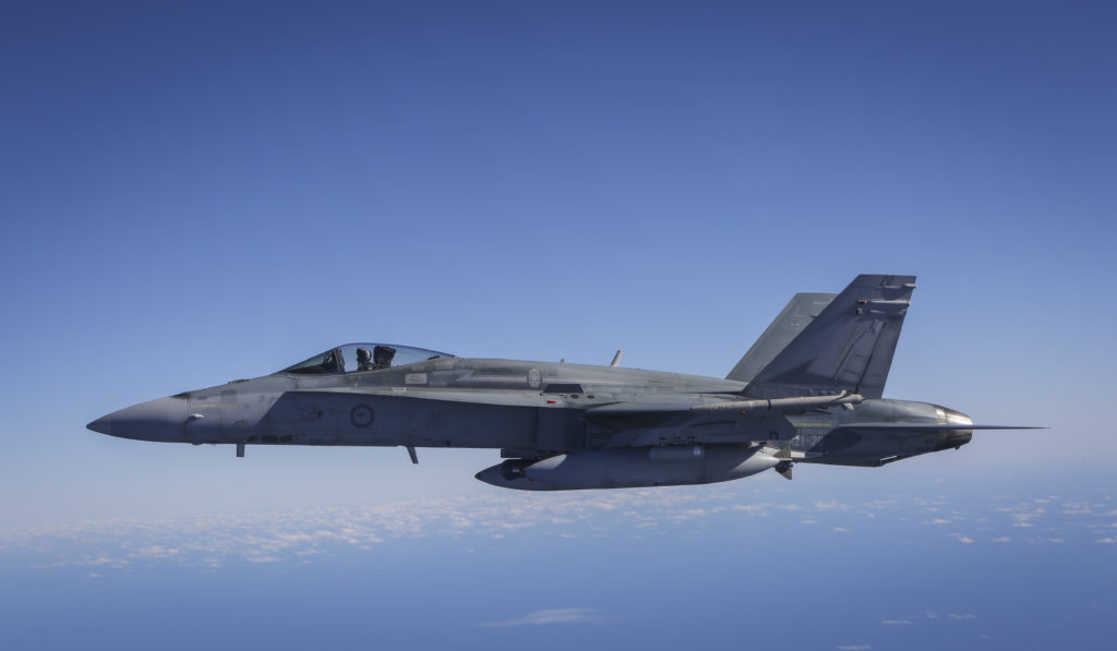 An F/A-18A Hornet following air-to-air refuelling from a KC-30A Multi-Role Tanker Transport during Exercise Diamond Shield.