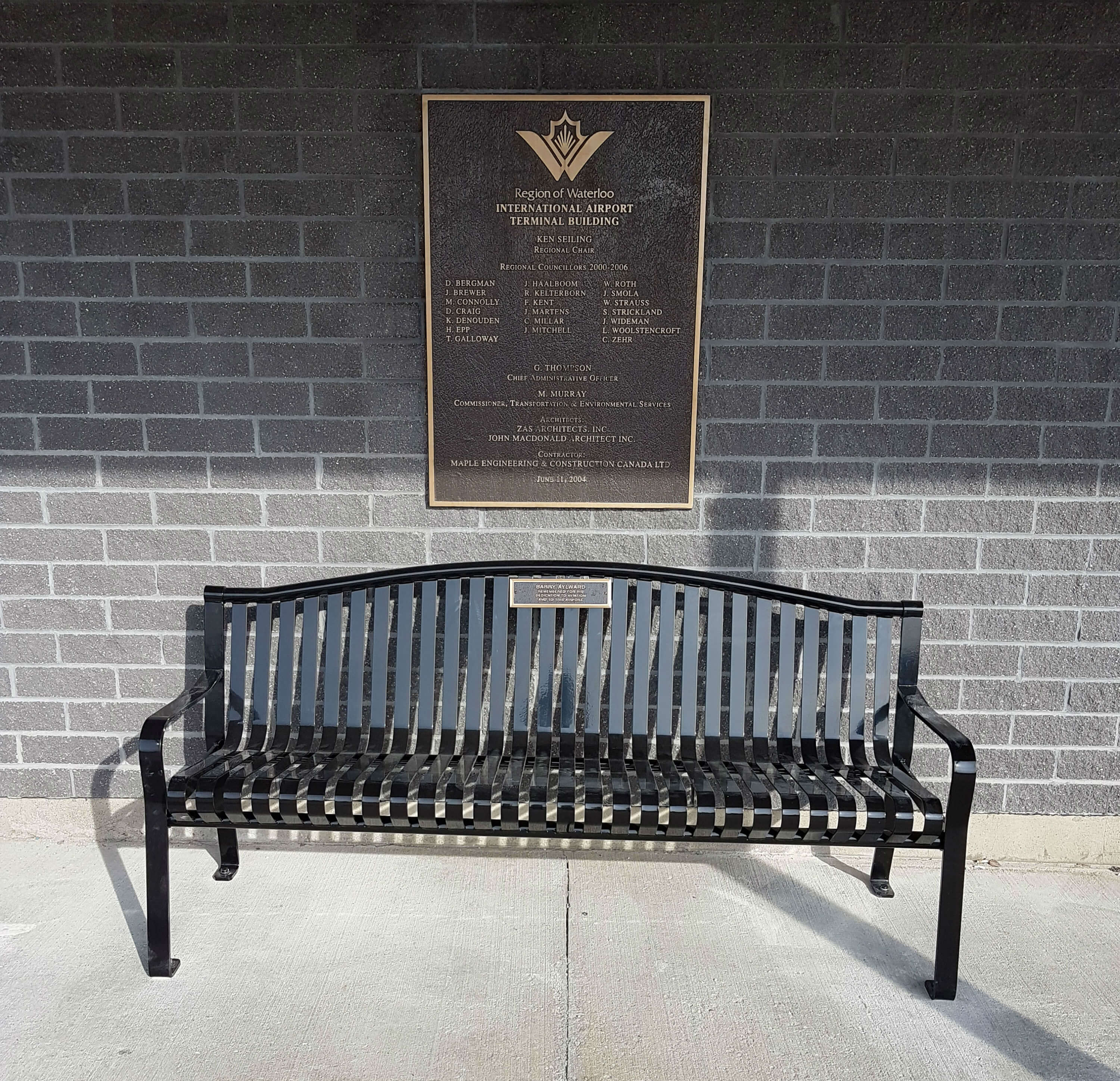 The memorial bench that pays tribute to Barry Aylward was installed in front of the terminal at the Region of Waterloo International Airport. Kitchener Aero Photo