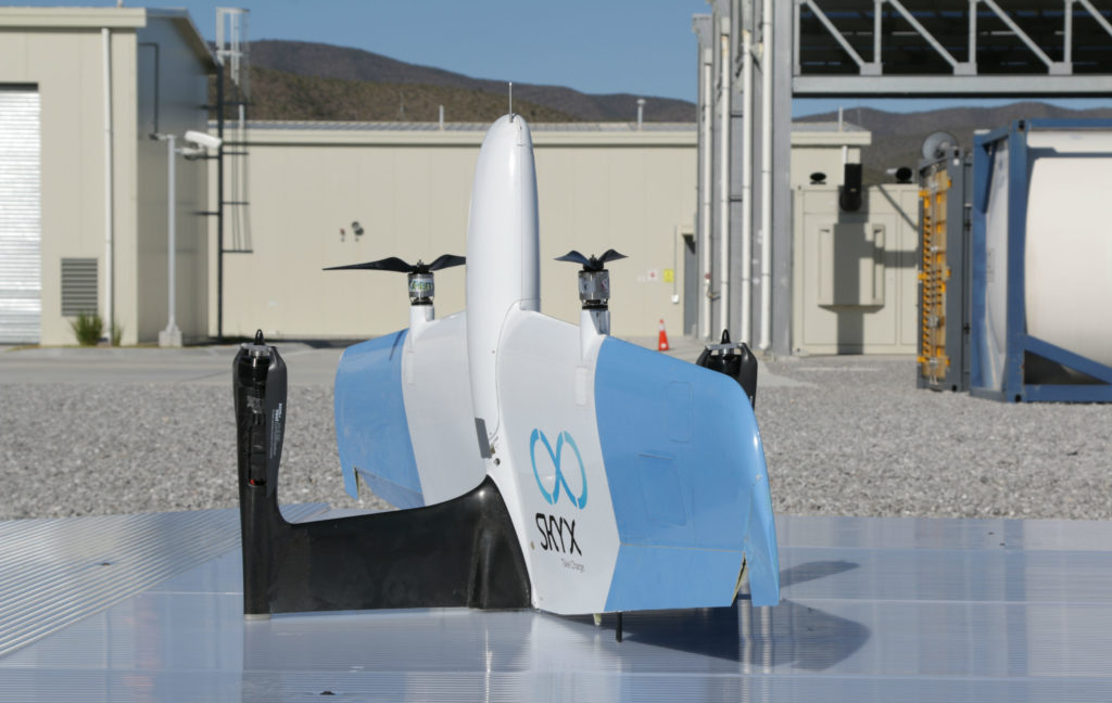 SkyOne drone rests on silver-coloured pad.