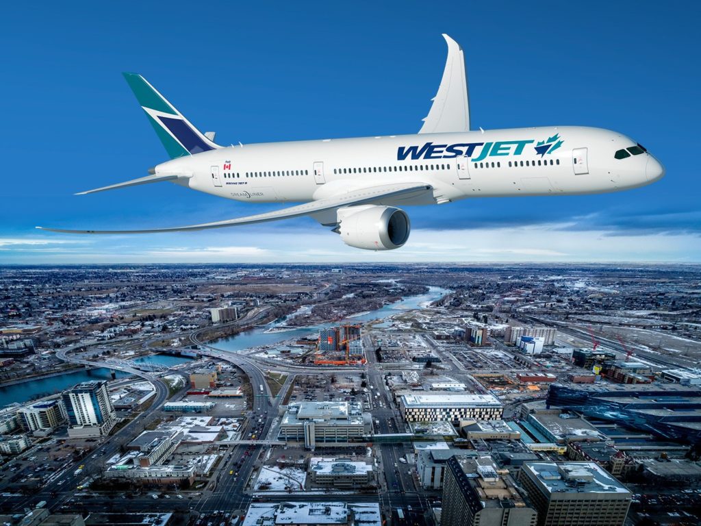 A Boeing 787-9 Dreamliner in WestJet livery flies over a cityscape.