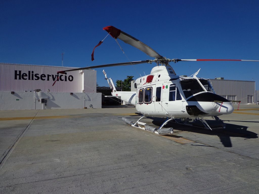 Heliservicio Bell 412 rests on ground