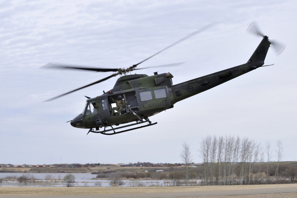 Crewmembers on board a Griffon helicopter from 430 Squadron return to the main training area of Exercise MAPLE RESOLVE on April 29, 2015.