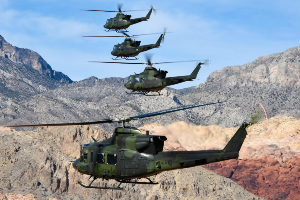 Four Griffon helicopters in flight