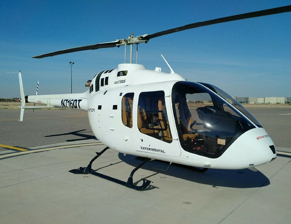 Bell 505 rests on ground