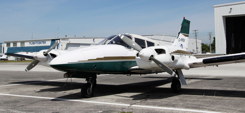 Piper Seneca aircraft rests on tarmac