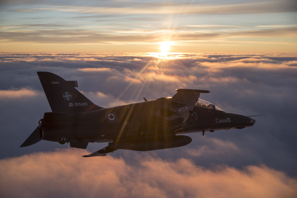 A CT-155 Hawk jet trainer flies above the clouds. 