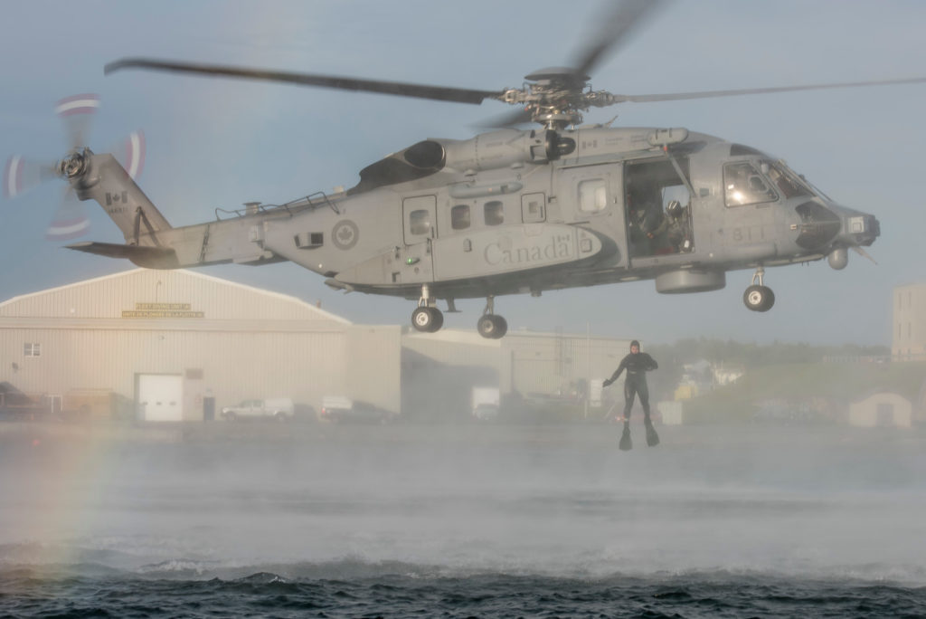 Helicopter Operational Test and Evaluation Facility, with assistance from with Fleet Diving Unit, conduct wet hoist training operations from a CH-148 Cyclone in and above the Halifax harbour. Cpl Anthony Laviolette Photo