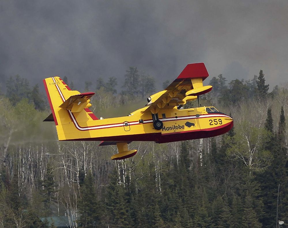 The contract includes the management, maintenance and operation of Manitoba's fleet of seven Canadair water-bomber amphibious aircraft (four CL-415s and three CL-215s). Government of Manitoba Photo 